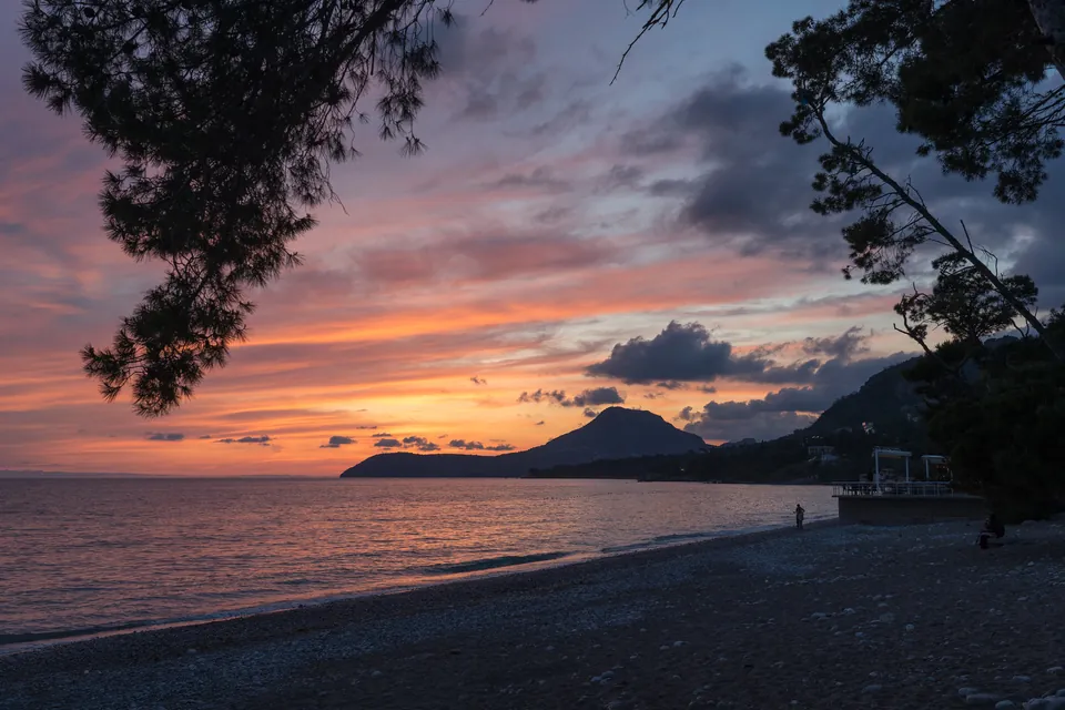 Orange sunset glow over the Adriatic Sea seen from Šušanj beach in Bar