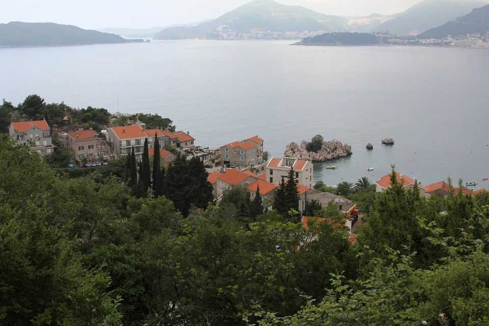 Panoramic view of the village of Pržno along the wooded coastline near Budva