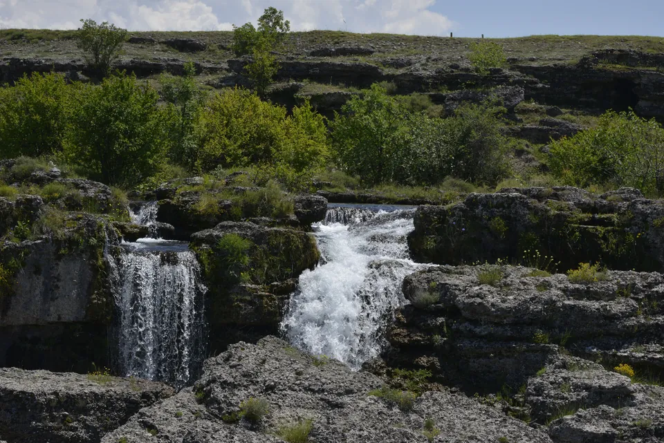 Cascading waterfalls of the Cijevna river tumbling over limestone terraces near Podgorica