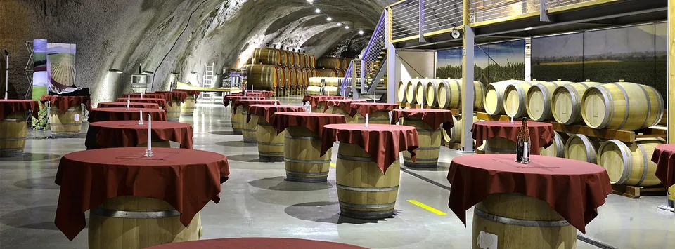 Tasting tables among the barrels in the cellar