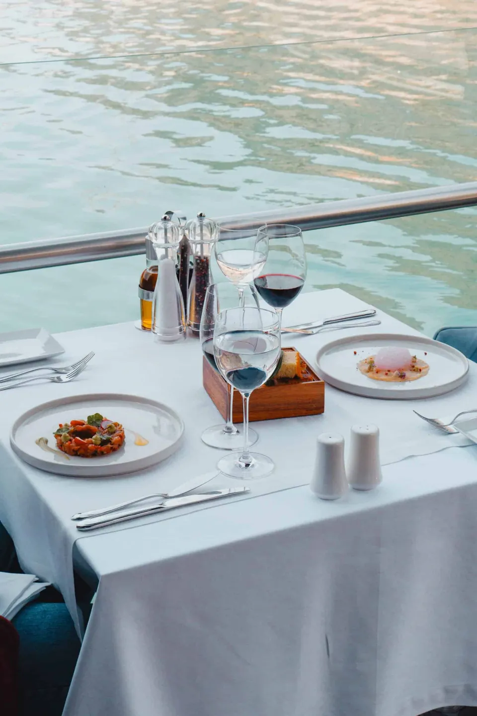 Table set beside the water on the restaurant terrace