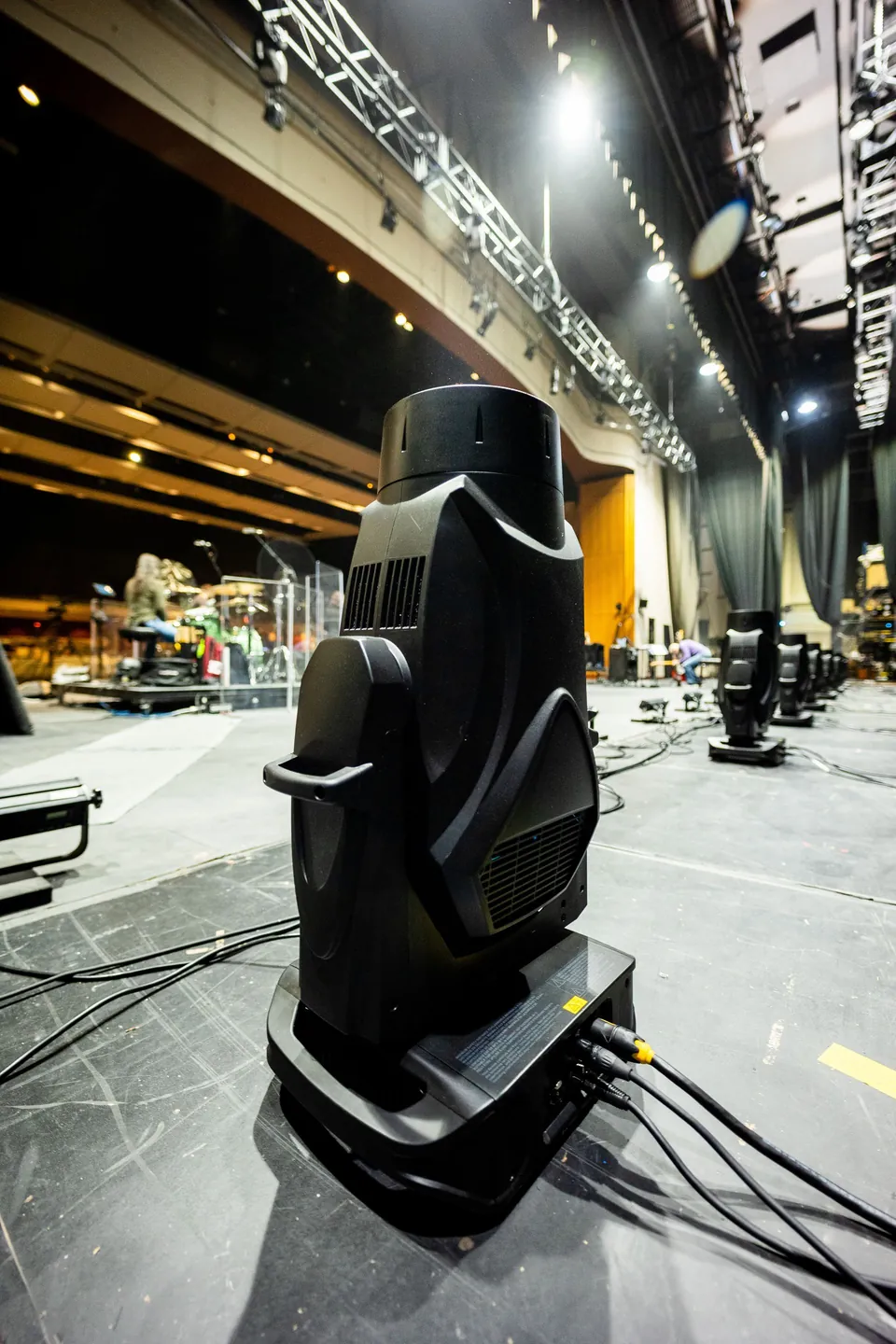Moving head light fixture on a stage floor during setup